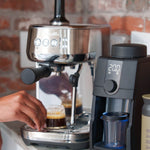 Baratza Encore ESP Pro | Coffee grinder on kitchen counter next to Breville espresso machine | Equator Coffees