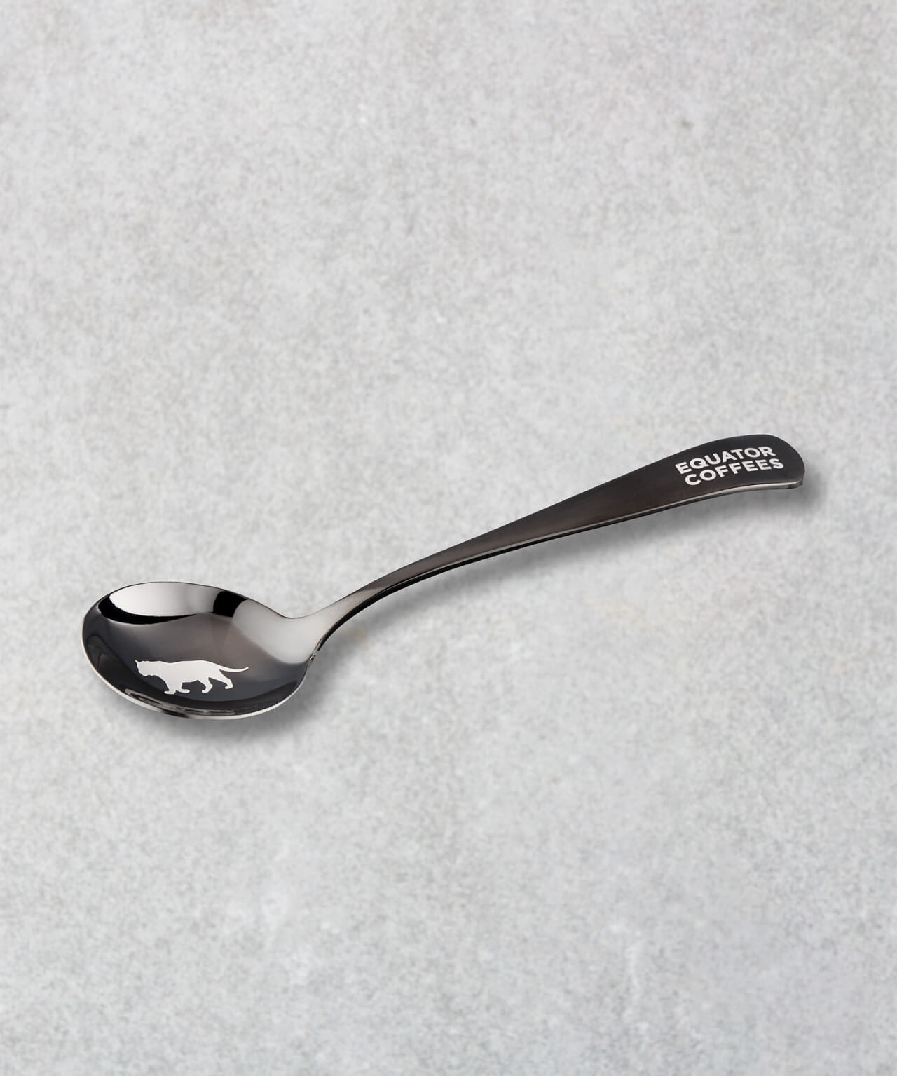 Equator Tiger Cupping Spoon on a grey background | Equator Coffees